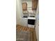 Convenient laundry room features a washer and dryer, shelving, and durable vinyl flooring at 11596 W Sierra Dawn Blvd # 247, Surprise, AZ 85378