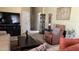 Comfortable living room with a recliner chair, contemporary decor, and a dark media center at 11596 W Sierra Dawn Blvd # 247, Surprise, AZ 85378