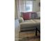 Cozy living room features a comfortable couch with decorative pillows and bright natural light at 11596 W Sierra Dawn Blvd # 247, Surprise, AZ 85378