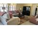 Cozy living room with comfortable seating, a modern TV, and a stylish rug at 11596 W Sierra Dawn Blvd # 247, Surprise, AZ 85378