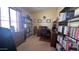 Home office features a desk, shelving, and natural light for a productive workspace at 11596 W Sierra Dawn Blvd # 247, Surprise, AZ 85378