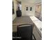 Covered patio features concrete flooring with views of an additional storage area at 11596 W Sierra Dawn Blvd # 247, Surprise, AZ 85378