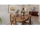 Elegant dining space with wood table, four chairs, and decorative accents at 11691 W Cactus Wren Ct, Surprise, AZ 85378