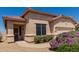 Beautiful one-story home with a tile roof, desert landscaping, and a two-car garage at 11691 W Cactus Wren Ct, Surprise, AZ 85378