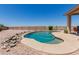 Inviting swimming pool with rock features and ample lounge space, perfect for relaxation at 11691 W Cactus Wren Ct, Surprise, AZ 85378