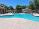 Beautiful community pool with lounge chairs, and a restroom cabana, perfect for relaxation and recreation at 1465 S Longspur S Ln, Gilbert, AZ 85296