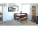 Cozy breakfast nook with a custom corner bench and dining table adjacent to an open living area at 1465 S Longspur S Ln, Gilbert, AZ 85296