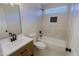 Bright bathroom featuring a tiled shower/bath and natural wood vanity at 16447 W Cottonwood St, Surprise, AZ 85388