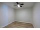 Bright bedroom with a ceiling fan and modern flooring at 16447 W Cottonwood St, Surprise, AZ 85388
