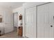 Hallway featuring wood-look floors and closet space at 16554 W Saguaro Ln, Surprise, AZ 85388