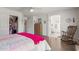Spacious main bedroom with ensuite bathroom, closet, and wood-look floors at 16554 W Saguaro Ln, Surprise, AZ 85388