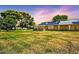Expansive backyard with ample green space and solar panels at 16842 N 103Rd Dr, Sun City, AZ 85351