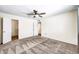 This bedroom features soft carpeting, neutral paint and updated ceiling fan for a cozy feel at 16842 N 103Rd Dr, Sun City, AZ 85351