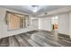 Bright and airy dining area featuring modern flooring and an open layout at 16842 N 103Rd Dr, Sun City, AZ 85351