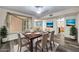 Well-appointed dining room featuring a large window and stylish furnishings at 16842 N 103Rd Dr, Sun City, AZ 85351