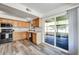Functional kitchen features wooden cabinets, laminate countertops, and stainless steel appliances at 16842 N 103Rd Dr, Sun City, AZ 85351