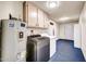 Laundry room featuring modern appliances and storage space at 16842 N 103Rd Dr, Sun City, AZ 85351