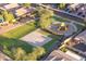 The aerial shot features a neighborhood park with playground and basketball court, complete with walking paths at 17416 W Ventura St, Surprise, AZ 85388