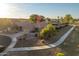 The elevated view shows a well-maintained front yard with desert landscaping and a convenient, paved walkway at 17416 W Ventura St, Surprise, AZ 85388