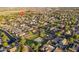 An aerial view of a neighborhood highlighting a park with a playground and recreational area, enhancing community appeal at 17416 W Ventura St, Surprise, AZ 85388