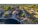 An aerial view of a home in a desert neighborhood, with a walking path along the side of the property at 17416 W Ventura St, Surprise, AZ 85388