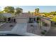 An aerial view of a single-story home with desert landscaping and mature trees at 17416 W Ventura St, Surprise, AZ 85388