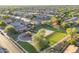 This aerial view showcases a neighborhood park with playground and basketball court, perfect for Gathering activities at 17416 W Ventura St, Surprise, AZ 85388