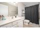 Well-lit bathroom featuring a single sink vanity and shower/tub combo at 17416 W Ventura St, Surprise, AZ 85388