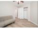 Spare bedroom showcasing a convertible couch with closet and doorway at 17416 W Ventura St, Surprise, AZ 85388