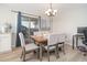 Cozy dining area with sliding glass doors and backyard views at 17416 W Ventura St, Surprise, AZ 85388