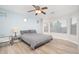 Spacious main bedroom with light blue accent wall and natural light at 17416 W Ventura St, Surprise, AZ 85388