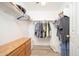 Walk-in closet with ample storage and wood dresser at 17416 W Ventura St, Surprise, AZ 85388