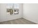 Bright, carpeted bedroom with window overlooking the front yard at 17830 W Mission Ln, Waddell, AZ 85355