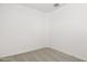 Minimalist bedroom featuring neutral carpet and light-colored walls at 17830 W Mission Ln, Waddell, AZ 85355