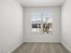 Bright, carpeted bedroom with window overlooking the front yard at 17830 W Mission Ln, Waddell, AZ 85355