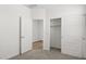 Bedroom with carpet, closet, and doorway to an adjacent room at 17830 W Mission Ln, Waddell, AZ 85355