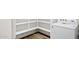Close-up on white Whirlpool washing machine in laundry area with shelving at 17830 W Mission Ln, Waddell, AZ 85355