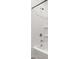 Modern bathtub and shower combination with white walls and sleek fixtures at 17830 W Mission Ln, Waddell, AZ 85355