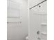 Bathroom shower with white tiles and modern fixtures at 17830 W Mission Ln, Waddell, AZ 85355