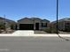 Charming single-story home with a two-car garage and well-maintained front yard at 18765 W Adams St, Buckeye, AZ 85326