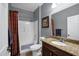 Neutral bathroom features a shower/tub combo, granite counters, and ample storage space at 20194 N Riverbank Rd, Maricopa, AZ 85138