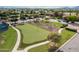 Aerial view of a beautiful bocce ball court surrounded by landscaping and other outdoor amenities at 20194 N Riverbank Rd, Maricopa, AZ 85138