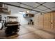 Spacious garage with storage, a wash sink, and a golf cart at 20194 N Riverbank Rd, Maricopa, AZ 85138