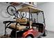 Close-up of a golf cart stored inside a garage space at 20194 N Riverbank Rd, Maricopa, AZ 85138