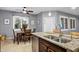 Bright eat-in kitchen featuring granite countertops, stainless steel appliances and natural light at 20194 N Riverbank Rd, Maricopa, AZ 85138