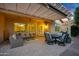 Outdoor patio with pergola, ceiling fan, seating area, dining table, chairs, and BBQ at 20194 N Riverbank Rd, Maricopa, AZ 85138