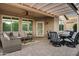 Outdoor patio with pergola, ceiling fan, seating area, dining table, chairs, and BBQ at 20194 N Riverbank Rd, Maricopa, AZ 85138