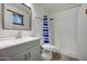 This full bathroom has an updated vanity and shower over tub at 2122 E Radcliffe Dr, Tempe, AZ 85283