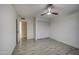 This bedroom is well-lit with a closet and sleek wood look flooring at 2122 E Radcliffe Dr, Tempe, AZ 85283