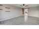 Bright living room featuring modern light fixtures, wood accents and stylish flooring at 2122 E Radcliffe Dr, Tempe, AZ 85283